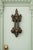 This impressive antique bronze door knocker features an ornate architectural design with strong vertical lines, scrolling...