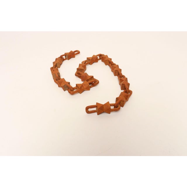 Whimsical Folk Art chain whittled from one continuous piece of wood (ca. 1930s/40s, USA). Unique form with carved bowtie...