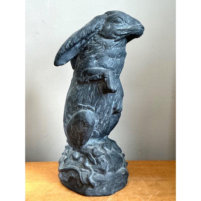 This vintage cast ecoplaster rabbit sculpture is a delightful example of mid-century decorative art, blending whimsical...