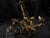 An exquisite 19th-century gilt-bronze three-arm chandelier showcasing exceptional craftsmanship and timeless European...
