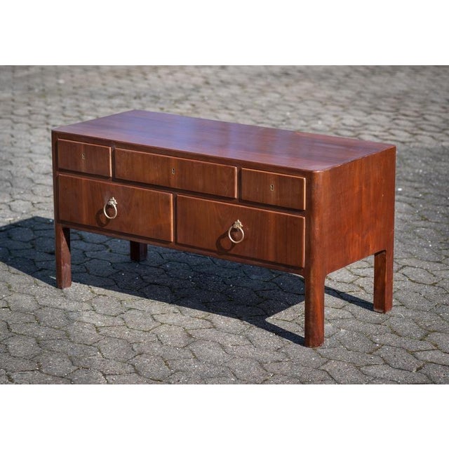 Chest of drawers or sideboard designed by Ernst Kühn in the 1930s, crafted in mahogany with five spacious drawers. The...
