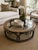 A striking mid-century Drexel coffee table featuring hand-painted Chinoiserie motifs, a circular glass insert, and an...