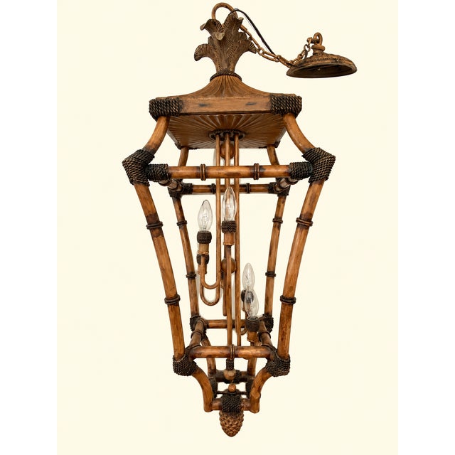 This vintage pagoda hanging lantern features an open, multi-tiered framework crafted in a faux-bamboo and rattan style....