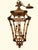 This vintage pagoda hanging lantern features an open, multi-tiered framework crafted in a faux-bamboo and rattan style....