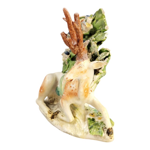 An early Derby porcelain figure of a recumbent stag, produced during the Patch period, circa 1759-1769. The figure is of...