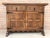 From northern spain, constructed of solid walnut, the rectangular top with molded edge atop a conforming case housing two...