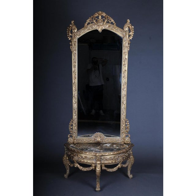 20th Century beautiful console mirror/floor mirror in the Louis XV, gilt Solid beechwood, carved and painted. Semicircular...