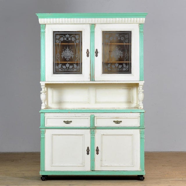 A large pine sideboard from around 1900, in its original paint. The sideboard consists of two separate sections. The top...