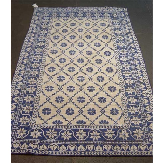 Hailing from a discerning line of carpet made with hand-knotted cotton originating from India between 1920-1930, this...