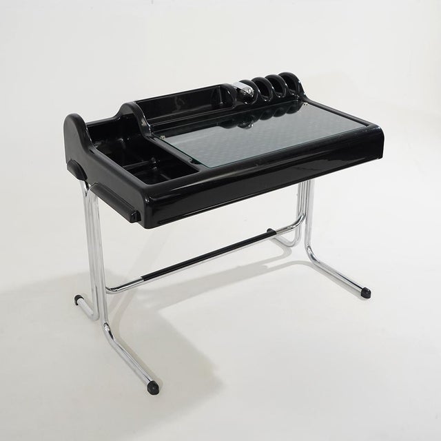 A desk designed by Vittorio Parigi and Nani Prina for Molteni in the 1970s, characterised by a chrome-plated tubular metal...