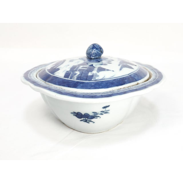 A fine antique Chinese Export porcelain covered vegetable dish. In the Canton pattern. Decorated in underglaze blue with a...