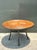 This distinctive vintage dining table beautifully balances natural texture with modern form, showcasing a meticulously...