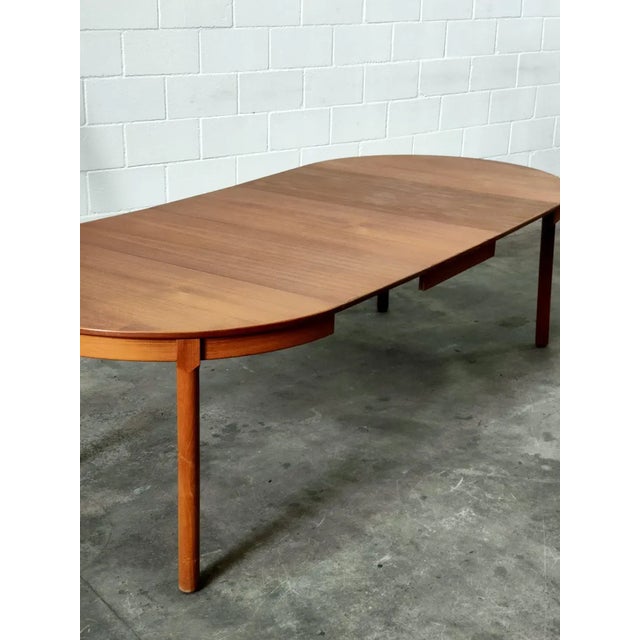 Extendable dining table, made of light hazelnut teak wood, the prestigious Danish manufacturer Gudme, was one of the...