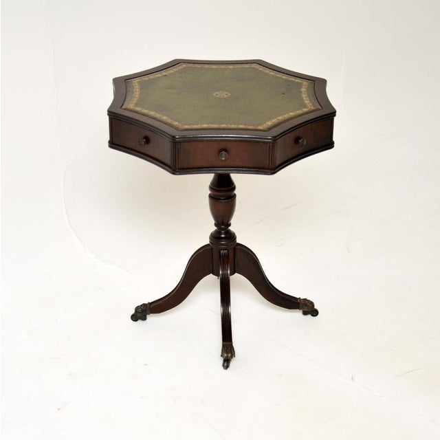 A lovely antique leather top drum table in the Georgian style. This was made in England, it dates from around the 1950’s....