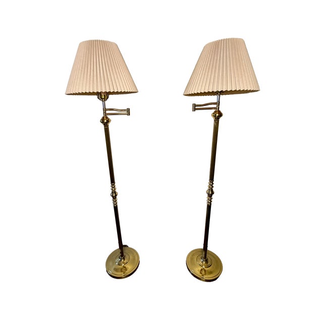 Elegant pair of vintage ALSY swing-arm floor lamps featuring slender fluted columns, traditional brass-tone detailing and...