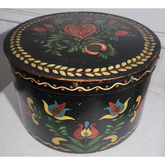 This 19Thc early pantry box was used in the kitchen for feeds and grains. This was paint decorated later in the early...