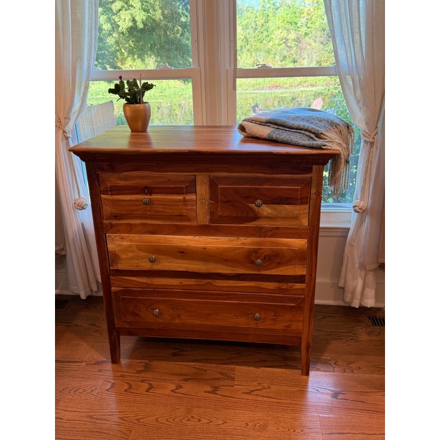 Beautifully restored four-drawer dresser attributed to Nadeau, featuring a richly varied natural hardwood grain and clean,...