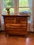 Beautifully restored four-drawer dresser attributed to Nadeau, featuring a richly varied natural hardwood grain and clean,...