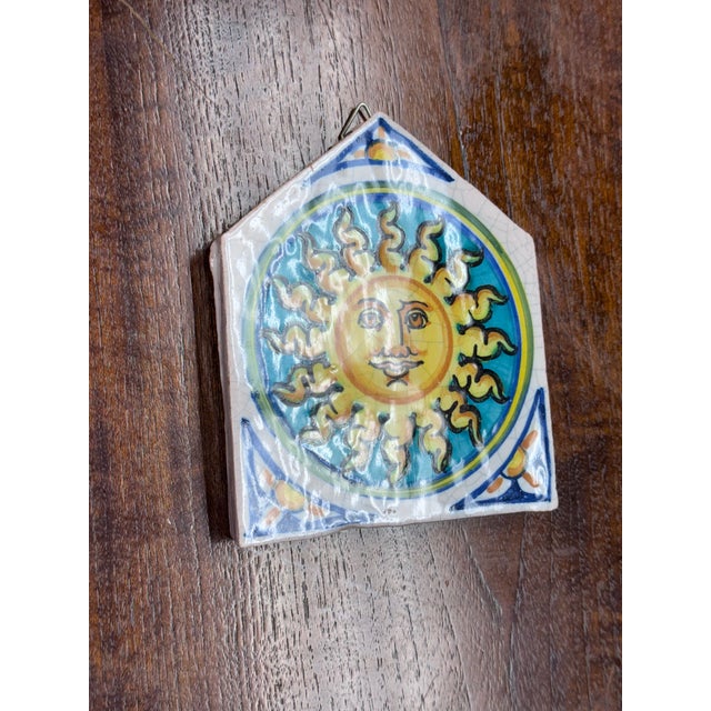 Design Plus Gallery presents the Vietri First Stones Sicilian Sun Wall Plaque. This is a hand-painted ceramic accent piece...