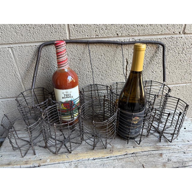 Rare Find: French wire bottle basket which holds 10 wine bottles. Moveable handle.