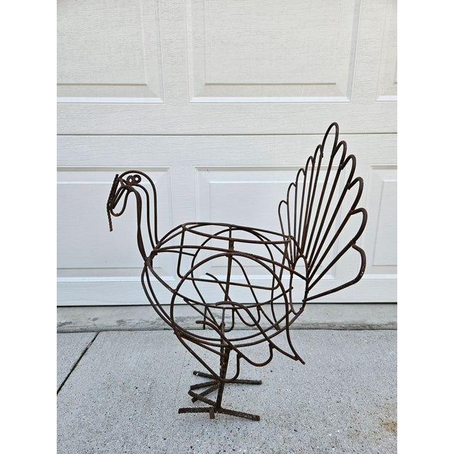 A fun and whimsical folk art wire turkey planter ready for your yard or garden. The interior dimension of the plant holder...