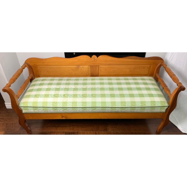 Mid 19th century Canadian Pine Bench upholstered tight seat cushion in green checked fabric.