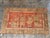 This distinctive antique Samarkand rug, dating to the early 1900s, features an unusual arrangement of ornamental vases,...