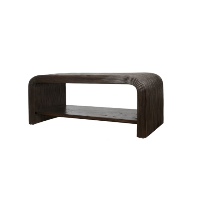 Elevate your living space with the Curved Rattan coffee table, a tasteful blend of natural rattan and solid mindi wood...