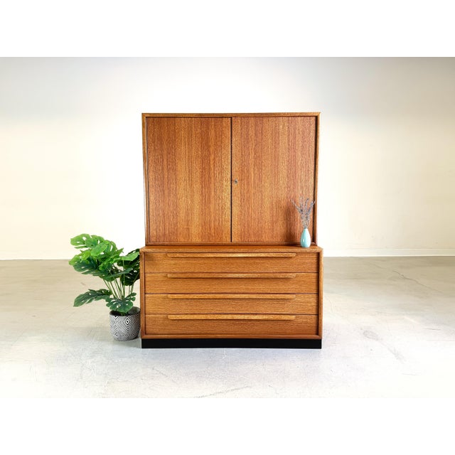 We are offering a beautiful teak bookcase or living room cabinet from WK Möbel for sale. The modules come from a wall...