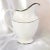This is a shiny white Royal Doulton creamer in the Signet pattern from 1963. It is plain with platinum trim. The creamer...