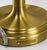A timeless pair of Ralph Lauren Home gold brass table lamps featuring elegantly turned silhouettes and substantial stepped...