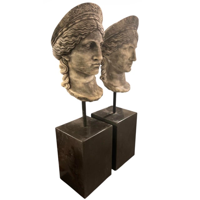 Elevate your interior with this sophisticated pair of Neoclassical-inspired sculptural busts. Expertly crafted from carved...