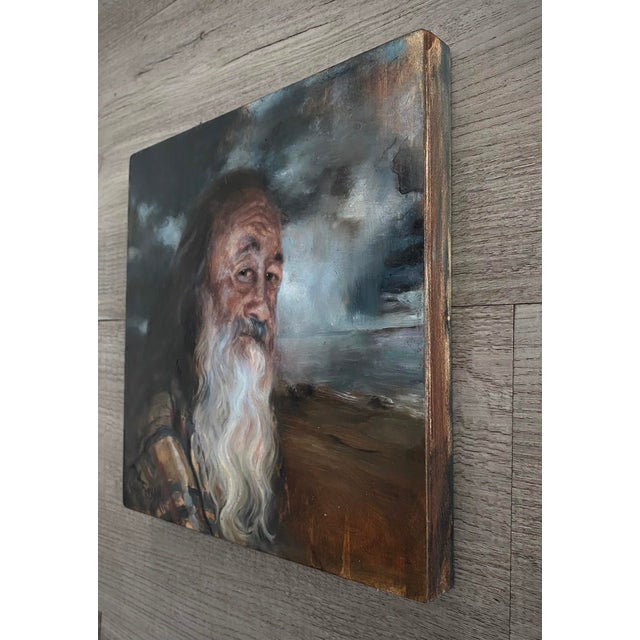 This intimate portrait captures an older man with a long beard, exuding a sense of wisdom and tranquility. The soft...