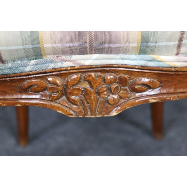 This set of 8 walnut Louis XVI cane and upholstery backed dining chairs is a superb blend of elegance, comfort, and...