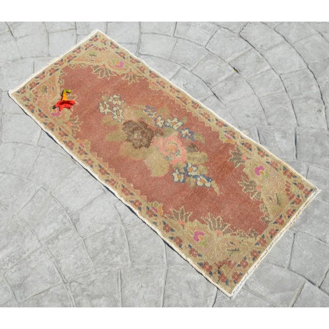 A vintage small rug, brown background color yastik rug perfect for a small guest bath or in front of the kitchen sink...