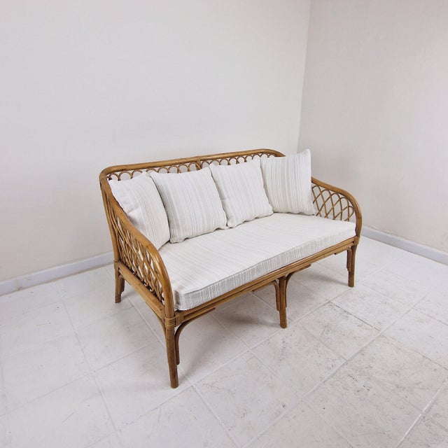 Exquisite vintage design settee fully crafted from high-quality bamboo and rattan, originating from Italy, circa 1970....