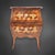 A small, two-drawer chest, also known in this version as a sauté chest. The body is curved and bombé on all sides, flowing...
