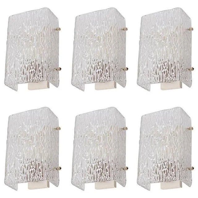 Beautiful glass sconces or wall lights from the 1960s produced by the high end glass manufacturer Kalmar. The thick...
