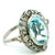 A beautifully proportioned Art Deco ring centered with an approximately 10 carat oval aquamarine, displaying a soft,...