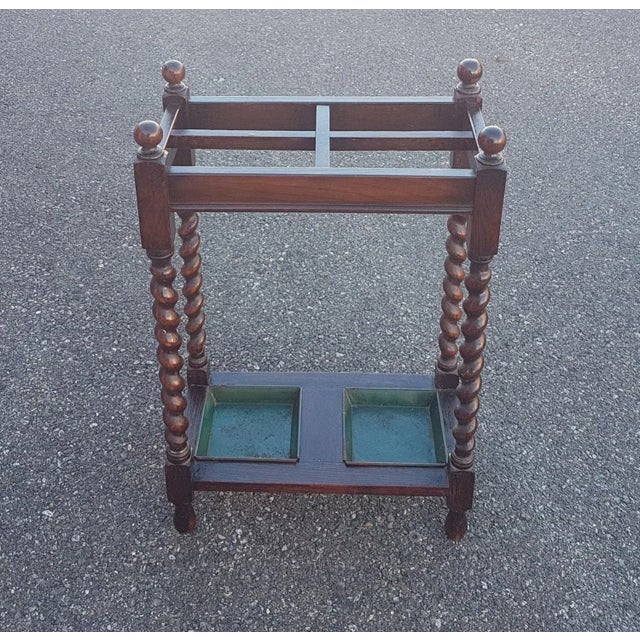 Beautiful vintage wooden umbrella / cane or stick holder. It has carved decoration at the top, the top is divided into...