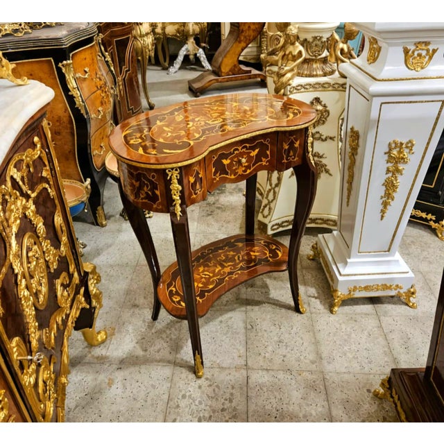 Delicate, graceful, and undeniably romantic, this stunning French Louis XV Side Table feels like a piece taken from an...