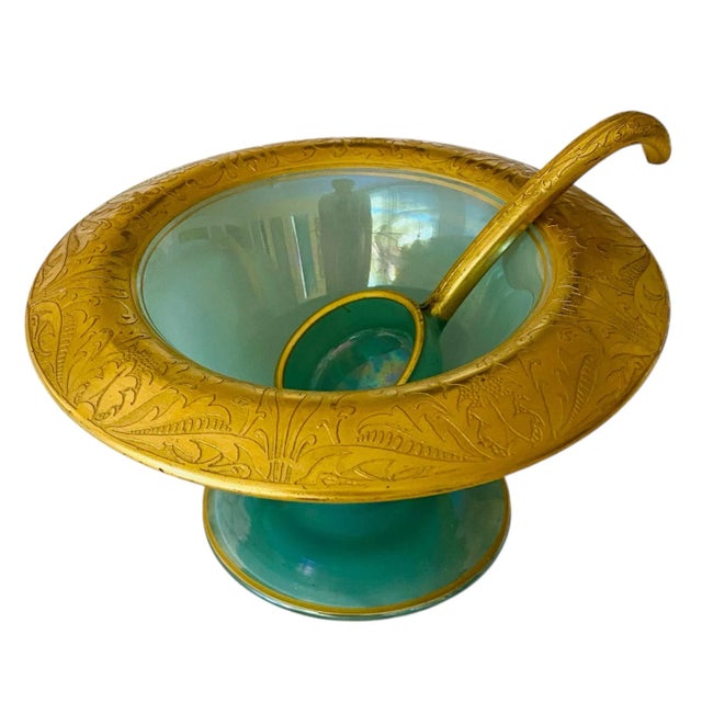 A stunning opaque green glass mayonnaise serving bowl with an embossed gold rim. The original serving spoon is included....