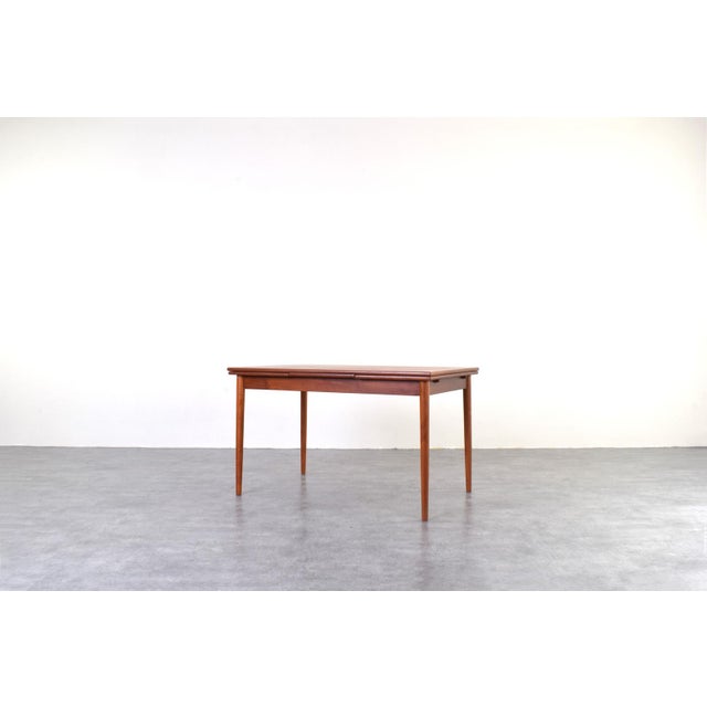 This teak extendable table was manufactured in Denmark in the 1960s. It has been professionally and carefully restored by...