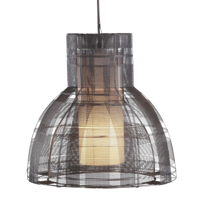 Handmade in the Philippines from galvanized iron, a malleable material which allows artisans to weave innovative shapes....