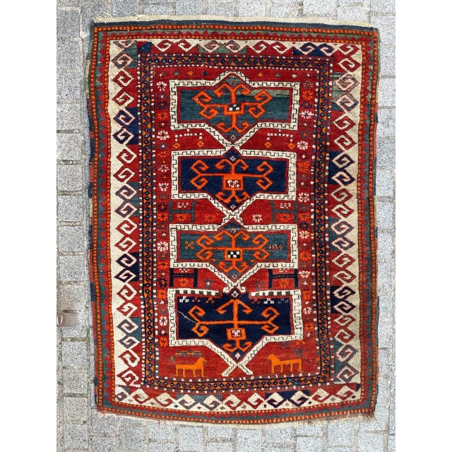 Authentic Early 20th Century Kazak Caucasian Rug entirely hand knotted with wool velvet on wool foundation Step into a...