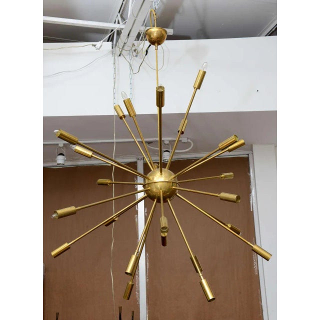 Stunning and huge brass Sputnik chandelier from Stilnovo, Italy. Twenty-Four-arm chandelier with adjustable, sliding...