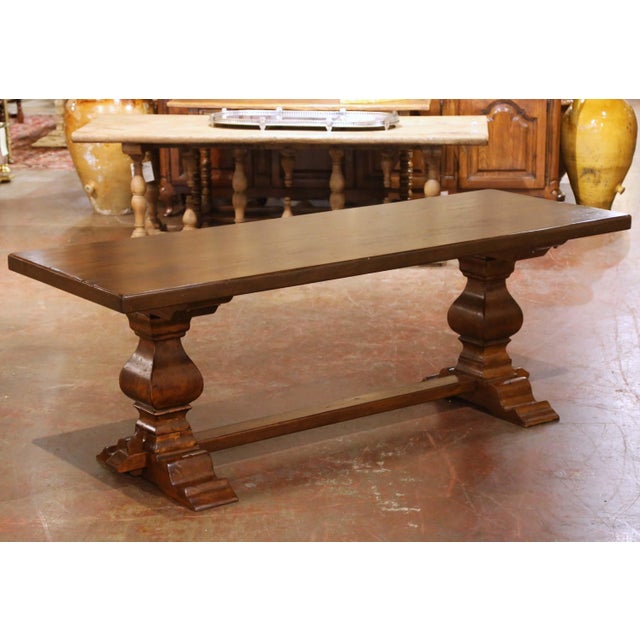 Crafted in France circa 1920, this impressive antique monastery refectory table reflects the robust character and timeless...