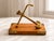 An elegant mid-century desk sculpture featuring a heavy, solid brass naval anchor masterfully mounted on a high-quality...