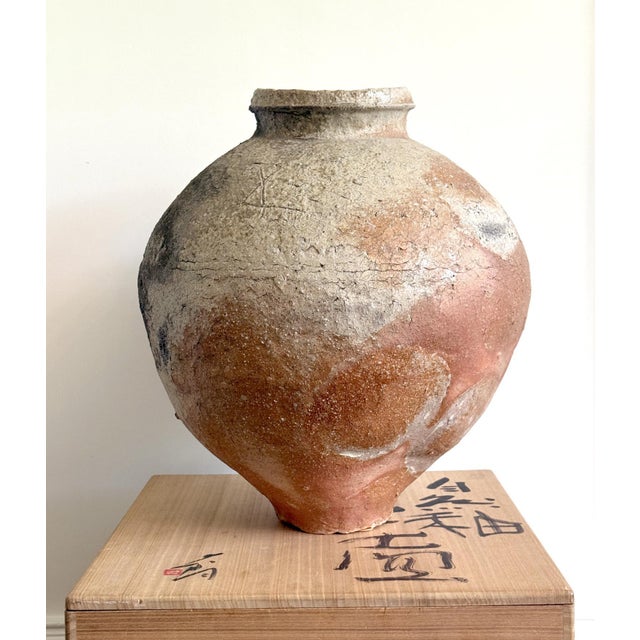 A large stoneware tsubo (jar) made in the tradition of Shigaraki ware by celebrated Japanese potter Shiro Tsujimura...
