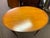 Early 20th century English Edwardian table. Beautiful satinwood top with banded inlay, mahogany base.Leg on metal castors.